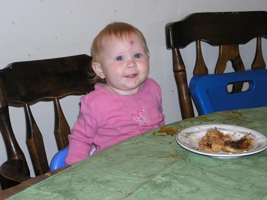 Sarah sits at the table.