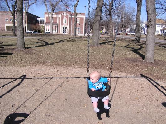 Noah swinging at the park.