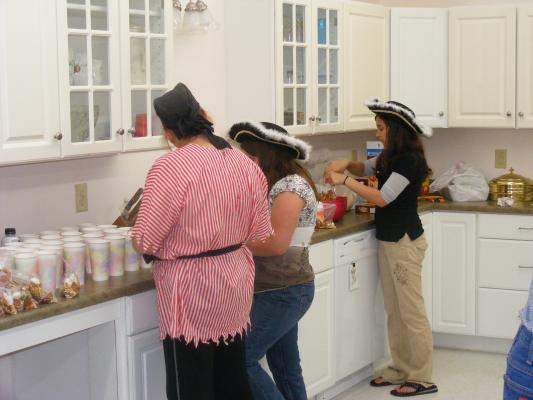 Miss Janet, Jennah and Malia are cooking up some fun for the kids on High Seas Expedition.