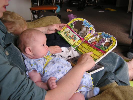 Katie reads last year's Easter book to Noah and Sarah.