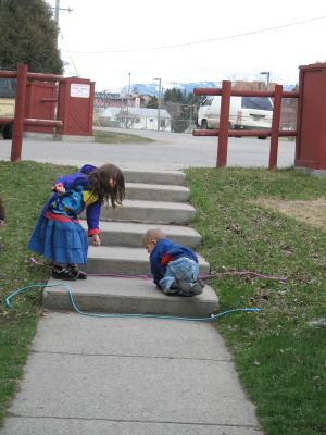 Andrea and Noah play on the steps.