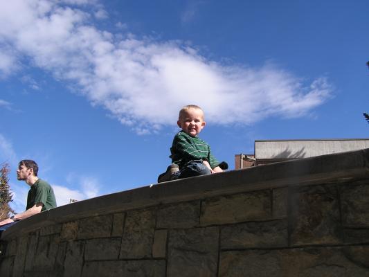 Noah climbs the wall.