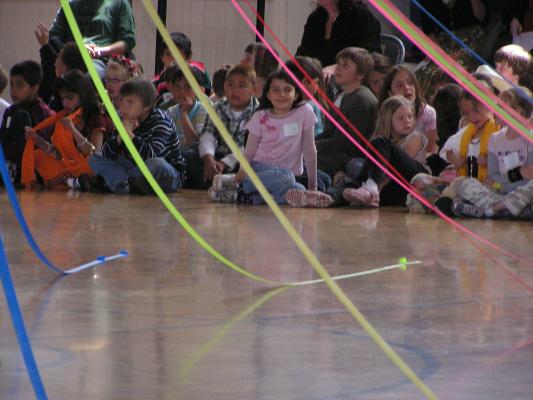 Malia sits with her class  on international day at Irving school.  Michaela is to her left.