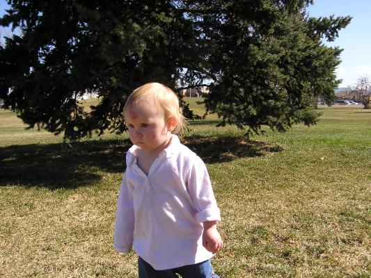 Sarah walks on the grass.