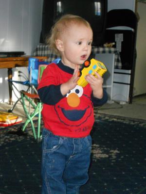 Joshua loves the toy bus Santa brought. 