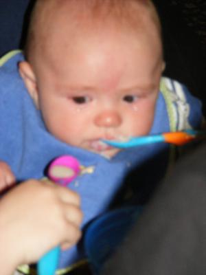 Joshua eats rice cereal
