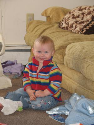 Sarah plays on the floor.