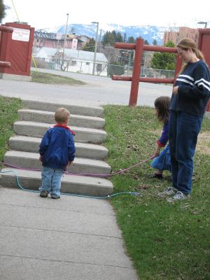 Noah, Andrea, and Katie play outside.