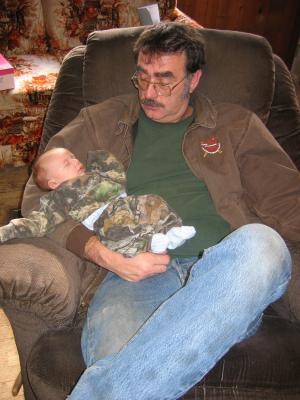 Carl Junior holds baby Jonathan.