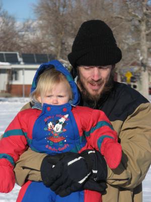 Sarah is all bundled up for sledding.