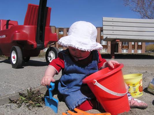 Sarah digs in the sand.
