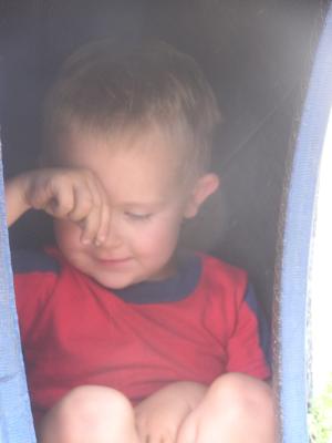 Noah in a tire at the park.