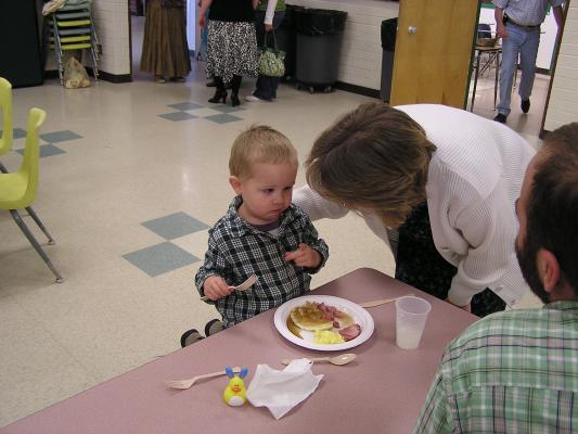 Deb talks to Noah at Easter breakfast.