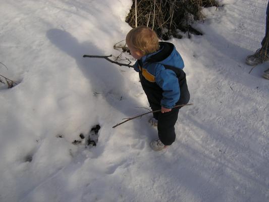Noah likes to write in the snow (with a stick)