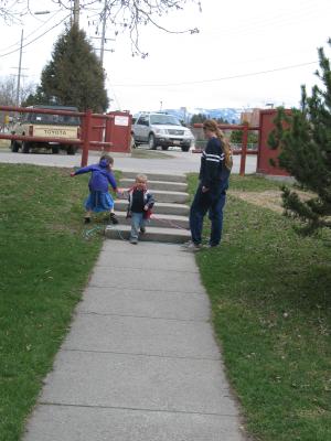 Andrea, Noah and Katie play outside.