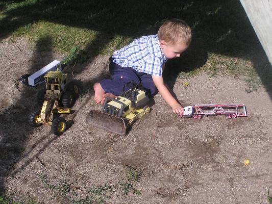 Noah likes to play in the sand.