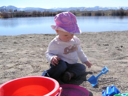 Sarah plays at the beach.