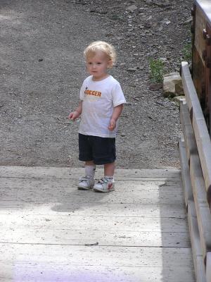 Noah gets ready to cross the bridge.