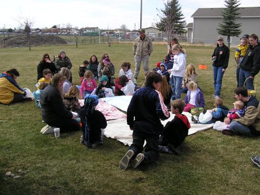 Deb tells the story of Easter to the kids.
