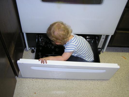 Noah plays in the stove.
