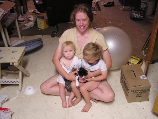 Katie with Sarah and Noah with cats