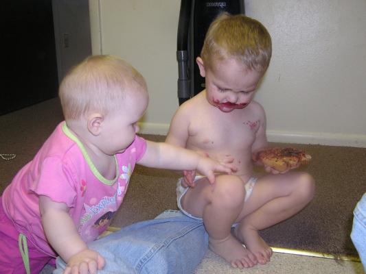 Sarah tries to get Noah's sandwhich.