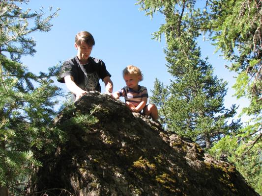 David and Noah at the top of a rock.