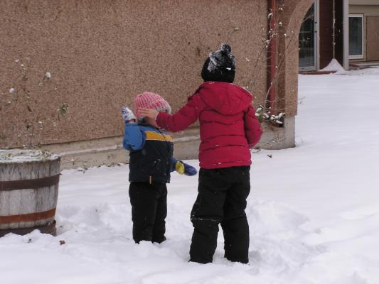 Noah is ready to throw more snow.
