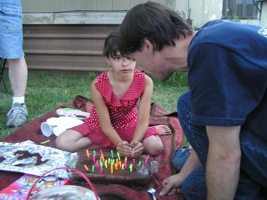 Malia and David try to lite the candles