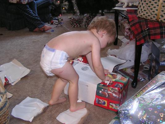 Noah opens his Christmas presents in his underwear.
