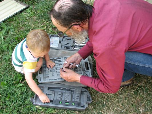 Noah plays with grandpa's tools