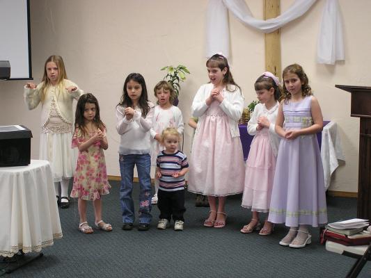 The kids practice their song for Church.