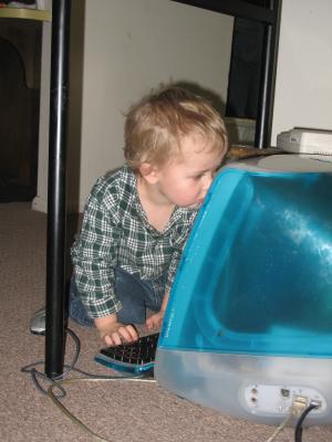 Noah plays on the iMac.