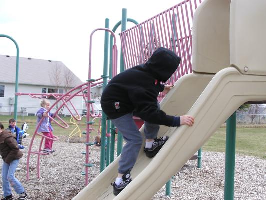 Kids play at the park before the Easter egg hunt.