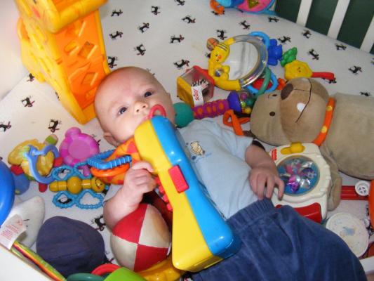 Noah got all the baby toys for Joshua to play with.