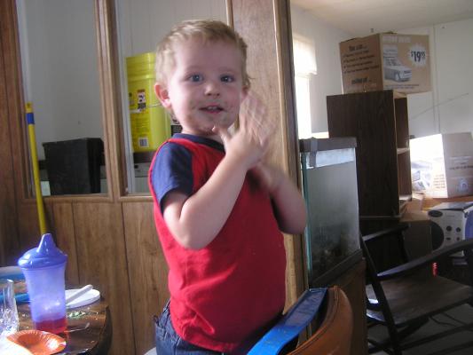 Noah is happy he ate birthday cake