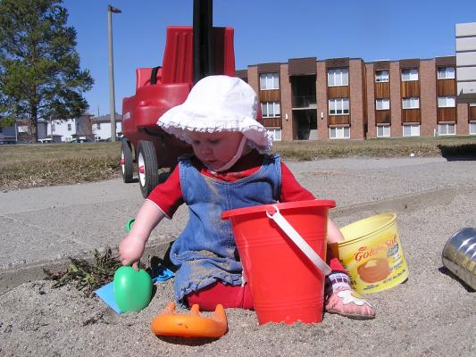 Sarah digs in the sand.