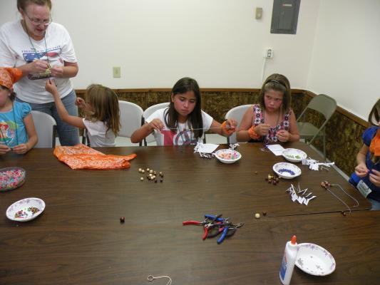 Orange Aspens at the craft table.