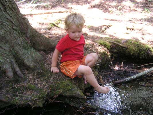 Noah feels the cold water on his toes