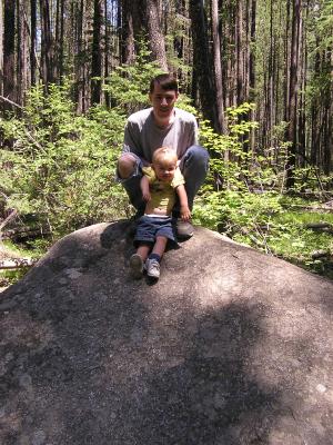 David and Noah on top of a big rock.