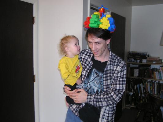 Noah admires the octagonal crown that daddy built.