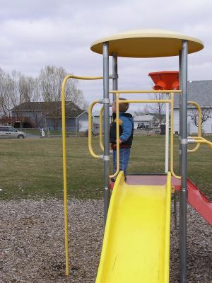 Noah plays at the park before the Easter egg hunt.
