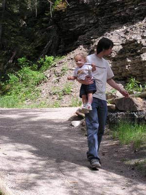 David and Noah walk down the trail.