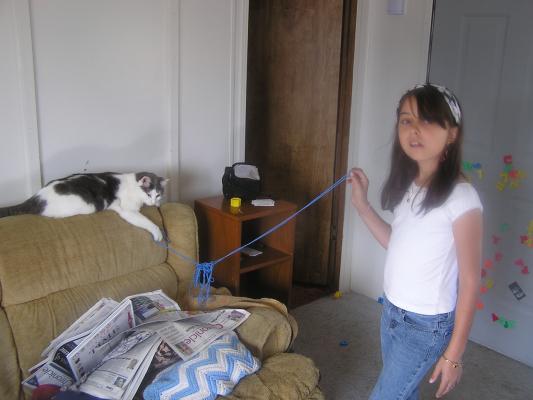 Malia plays with the cat