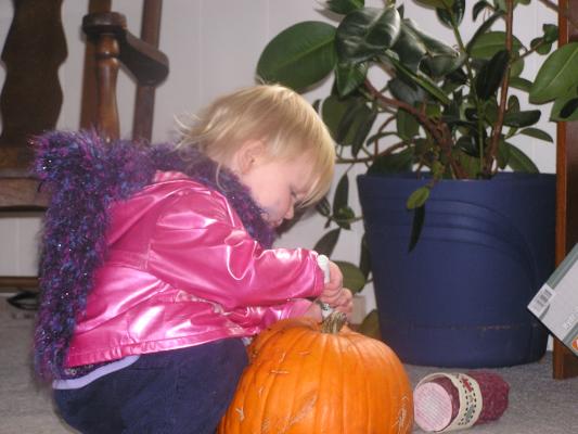 Sarah is all dressed up and ready to color a pumpkin