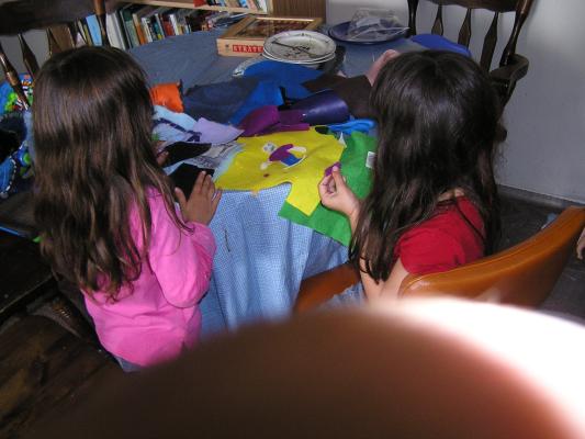Andrea and Malia cut things out with felt.