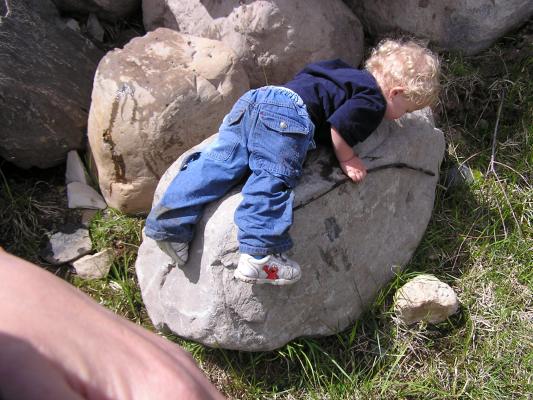 Noah gives this rock a hug.