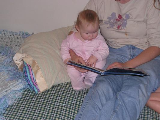 Sarah listens to a bedtime story.
