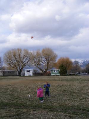 Sarah and Noah fly the kite.