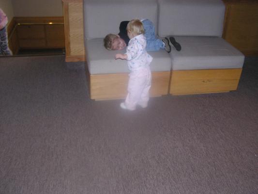 Noah and Sarah play on a bench.